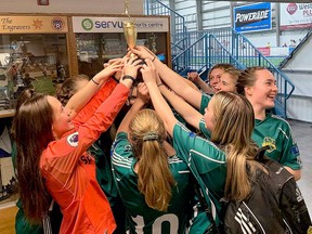 The Spruce Grove Soccer girls Saints Under-17 team celebrates after taking gold at the recent Edmonton Minor Soccer Association West Slush Cup Tournament from Feb. 27-March 1.