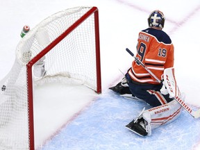 Mikko Koskinen #19 of the Edmonton Oilers is unable to stop a shot by Dominik Kubalik of the Chicago Blackhawks on a power play in the second period duing Game One of the Eastern Conference Qualification Round prior to the 2020 NHL Stanley Cup Playoffs at Rogers Place on August 01, 2020 in Edmonton.