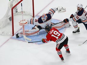 Jonathan Toews #19 of the Chicago Blackhawks misses a shot against Mikko Koskinen #19 of the Edmonton Oilers during the third period in Game 3 of the Western Conference Qualification Round at Rogers Place on August 05, 2020.