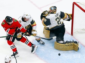 Marc-Andre Fleury #29 of the Vegas Golden Knights makes the third period kick save on Drake Caggiula #91 of the Chicago Blackhawks in Game 3 of the Western Conference First Round during the 2020 NHL Stanley Cup Playoffs at Rogers Place on August 15, 2020.