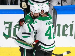Jamie Benn and Alexander Radulov of the Dallas Stars celebrate their victory over the Colorado Avalanche in Game 1 of the Western Conference second round of the 2020 NHL Stanley Cup Playoffs at Rogers Place on August 22, 2020.