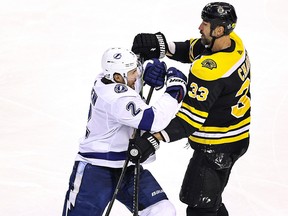 Luke Schenn of the Tampa Bay Lightning scuffles with Zdeno Chara of the Boston Bruins in Game 3 of the Eastern Conference second round of the 2020 NHL Stanley Cup Playoffs at Scotiabank Arena on August 26, 2020 in Toronto.