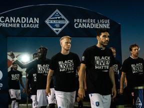 FC Edmonton players take to the field wearing Black Lives Matter shirts to open the Canadian Premier League's Island Games earlier this month.