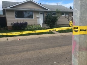 Edmonton police taped off a home at 7303 90 Avenue on the morning of Aug. 8, 2020, after shots were fired at a house party overnight.