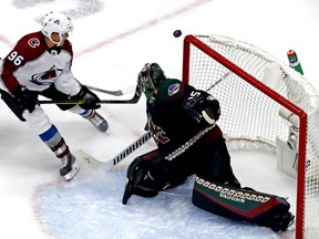 Arizona Coyotes goaltender Darcy Kuemper (35) makes a save against Colorado Avalanche right wing Mikko Rantanen (96) during the third period in Game 3 of the first round of the 2020 Stanley Cup Playoffs at Rogers Place on Saturday Aug. 15, 2020.