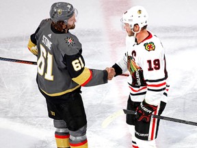 Vegas Golden Knights right wing Mark Stone (61) shakes hands with Chicago Blackhawks center Jonathan Toews (19) after Game 5 of the first round of the 2020 Stanley Cup Playoffs at Rogers Place on Tuesday, Aug. 18, 2020.