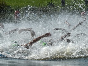 Arms splash in the elite men's 750 metre race during the ITU World Triathlon at Hawrelak Park in Edmonton on July 20, 2019.