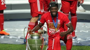 Bayern Munich's Alphonso Davies poses with the Champions League trophy after defeating Paris Saint-Germain 1-0 at Estadio da Luz in Lisbon, Portugal, on August 23, 2020.