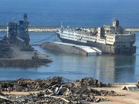 This picture shows a capsized ship at Beirut's port in the aftermath of a huge chemical explosion that disfigured the Lebanese capital, on August 14, 2020.