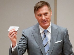 People's Party of Canada (PPC) leader Maxime Bernier casts his ballot as he votes in the federal election in Beauce, Que., Oct. 21, 2019.
