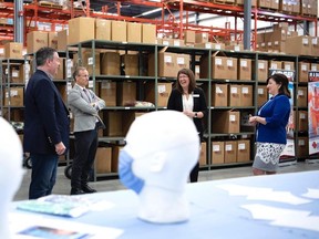 Premier Jason Kenney and Education Minister Adriana LaGrange visited IFR Workwear on July 18, 2020. Kenney held up the business as an example of private sector initiative part of the government's Bits and Pieces Program.