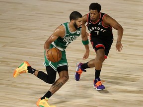 Jayson Tatum of the Boston Celtics drives the ball against Kyle Lowry of the Toronto Raptors during Game 6.