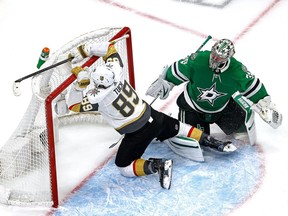 Alex Tuch #89 of the Vegas Golden Knights collides with the goal against Anton Khudobin #35 of the Dallas Stars during the second period in Game 4 of the Western Conference Final during the 2020 NHL Stanley Cup Playoffs at Rogers Place on September 12, 2020.