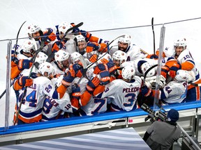 Jordan Eberle (7) of the New York Islanders is congratulated by his teammates after scoring in double-overtime against the Tampa Bay Lightning during Game 5 of the Eastern Conference final of the 2020 Stanley Cup Playoffs at Rogers Place on Sept. 15, 2020.