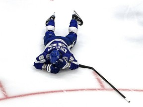 Nikita Kucherov of the Tampa Bay Lightning reacts after getting hit against the Dallas Stars in Game 2 of the 2020 NHL Stanley Cup Final at Rogers Place on Sept. 21, 2020.