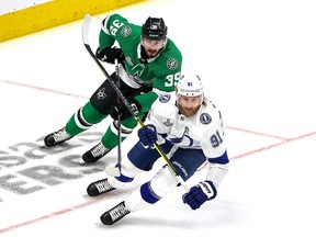 Steven Stamkos (91) of the Tampa Bay Lightning skates against Joel Hanley (39) of the Dallas Stars during the first period in Game Three of the 2020 NHL Stanley Cup Final at Rogers Place on September 23, 2020.