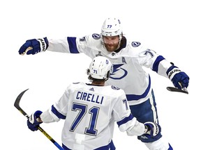 Victor Hedman (77) of the Tampa Bay Lightning is congratulated by teammate Anthony Cirelli (71) after scoring a goal against the Dallas Stars in Game Three of the 2020 NHL Stanley Cup Final at Rogers Place on Sept. 23, 2020.