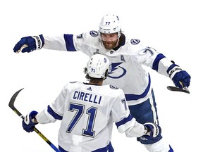 ictor Hedman (77) of the Tampa Bay Lightning is congratulated by Anthony Cirelli (71) after scoring a goal against the Dallas Stars during the second period in Game 3 of the 2020 NHL Stanley Cup Final at Rogers Place on September 23, 2020. Canada.