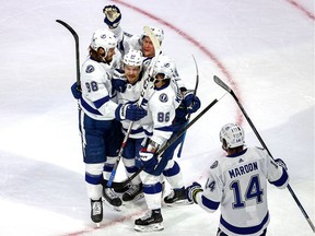 EDMONTON, ALBERTA - SEPTEMBER 25:  Yanni Gourde #37 of the Tampa Bay Lightning is congratulated by his teammates after scoring a goal against the Dallas Stars during the second period in Game Four of the 2020 NHL Stanley Cup Final at Rogers Place on September 25, 2020 in Edmonton, Alberta, Canada.