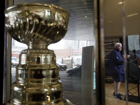 A replica Stanley Cup is visible in the foreground as then-Edmonton Oilers head coach Ken Hitchcock speaks to the media at Rogers Place in this file photo from March 25, 2019.
