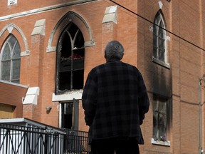 Former parishioner Dave Josh Littlefeather surveys the fire damaged at the Sacred Heart Catholic Church of the First Peoples, 10821 96 St., in Edmonton Monday Aug. 31, 2020. The church was heavily damaged in an Aug. 30, 2020 fire. Photo by David Bloom
