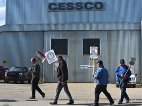 Employees walk the picket line outside the CESSCO manufacturing plant Sept. 8, 2020 after being locked out by the company.