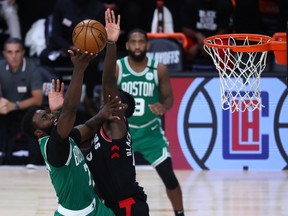 Toronto Raptors forward Pascal Siakam blocks Boston Celtics guard Jaylen Brown during Game 6 of the second round of the playoffs.