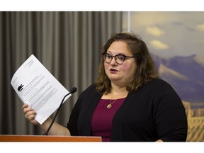 NDP education critic Sarah Hoffman holds up FOIP document that she says reveal that Education Minister Adriana LaGrange is hiding documents related to the COVID-19 response to reopening schools.