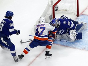 Tampa Bay Lightning goaltender Andrei Vasilevskiy (88) blocks a shot as defenseman Mikhail Sergachev (98) helps defend against New York Islanders center Leo Komarov (47) during the second period in Game 5 of the Eastern Conference Final of the 2020 Stanley Cup Playoffs at Rogers Place on Sept. 15, 2020.