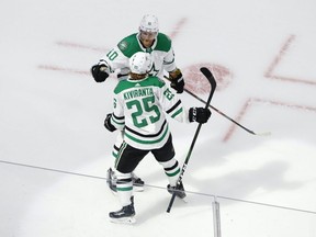 Dallas Stars winger Joel Kiviranta (25) celebrates with forward Corey Perry (10) after scoring a goal against the Tampa Bay Lightning during the second period in Game 1 of the 2020 Stanley Cup Final at Rogers Place on Sept. 19, 2020.