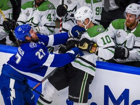 Tampa Bay Lightning defenceman Ryan McDonagh (27) checks Dallas Stars right wing Corey Perry (10) during the second period in game two of the 2020 Stanley Cup Final at Rogers Place on Sept. 21, 2020.