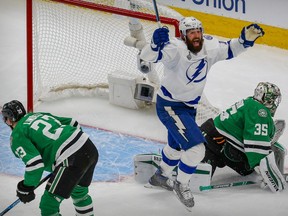 Tampa Bay Lightning left wing Patrick Maroon (14) celebrates a goal by center Blake Coleman (not pictured) against Dallas Stars goaltender Anton Khudobin (35) during the second period in Game 6 of the 2020 Stanley Cup Final at Rogers Place on Sept. 29, 2020.