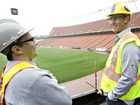 Edmonton quarterback Ricky Ray checks out a tour of the new facilities under construction at Commonwealth Stadium alongside team equipment manager Dwayne Mandrusiak in this file photo taken May 21, 2010.