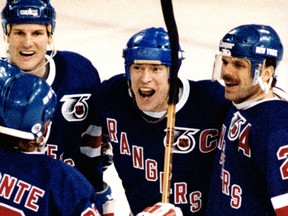 New York Rangers Mark Messier celebrates scoring the winning goal against the Edmonton Oilers at the Edmonton Coliseum in this file photo from Jan. 23, 1992.