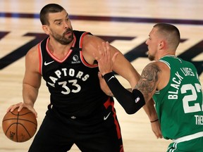 Marc Gasol of the Toronto Raptors is defended by Daniel Theis of the Boston Celtics during the first quarter in Game 6 of the Eastern Conference semifinal on Sept. 9, 2020 in Lake Buena Vista, Fla.