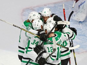 The Dallas Stars celebrate a goal against the Colorado Avalanche by defenseman Miro Heiskanen (4) in Game 5 of their 2020 Stanley Cup Playoffs round at Rogers Place.