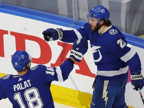 Tampa Bay Lighting left winger Ondrej Palat (18) congratulates center Brayden Point (21) after a goal during in Game 1 of the Eastern Conference final of the 2020 Stanley Cup Playoffs against the New York Islanders at Rogers Place on Sept. 7, 2020.