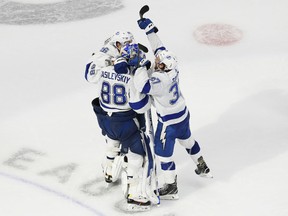 The Tampa Bay Lightning celebrate their 2-1 overtime win over the New York Islanders in Game 6 of the Eastern Conference Final of the 2020 Stanley Cup Playoffs at Rogers Place.