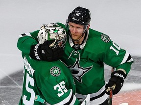 Corey Perry and Anton Khudobin of the Dallas Stars celebrate the team's 3-2 overtime victory against the Vegas Golden Knights in Game Three of the Western Conference Final at Rogers Place in Edmonton on Sept. 10, 2020.