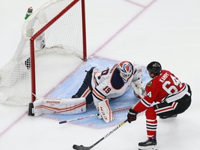 Mikko Koskinen #19 of the Edmonton Oilers stops a shot from David Kampf #64 of the Chicago Blackhawks during the second period in Game 4 of the Western Conference Qualification Round on August 07, 2020.