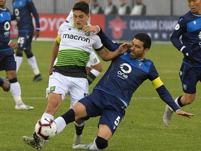 York 9 midfielder Manuel Apricio (10) battles for the ball with FC Edmonton defender Ramon Soria Alonso (5) in this file photo from June 5, 2019.