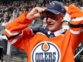 Ryan McLeod reacts after being selected 40th overall by the Edmonton Oilers on June 23, 2018, during the 2018 NHL Draft at Dallas's American Airlines Center.