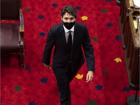 Prime Minister Justin Trudeau heads back to his seat before the delivery of the Speech from the Throne at the Senate of Canada Building in Ottawa, Sept. 23, 2020.