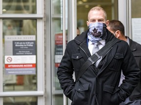 Const. Alexander Dunn, the police officer charged with assault for slamming Dalia Kafi to the floor, walks out of Calgary Courts Centre on Wednesday, October 28, 2020.