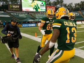 Edmonton Football Club receiver Greg Ellingson (82) celebrates a touchdown against the B.C. Lions with teammate Ricky Collins Jr. (13) at Commonwealth Stadium on June 21, 2019.