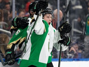 Prince Albert Raiders defenceman Kaiden Guhle celebrates his team's overtime win with teammates over the Edmonton Oil Kings during a WHL hockey game at Rogers Place in Edmonton, on Friday, Jan. 17, 2020.