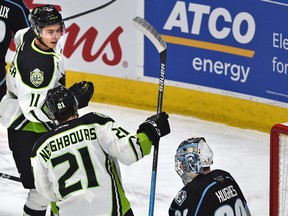 Edmonton Oil Kings Dylan Guenther (11) celebrates his goal wtih Jake Neighbours (21) against Winnipeg Ice goalie Liam Hughes (30) to  set a club record for rookie points on Feb. 25, 2020, at Rogers Place.
