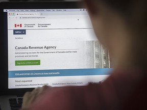 A person looks at a Canada Revenue Agency homepage in Montreal, Sunday, August 16, 2020, as the COVID-19 pandemic continues in Canada and around the world.
