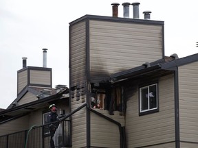 Firefighters respond to a morning fire at Ridgewood Gardens near 40 Street and 26 Avenue on Tuesday, Oct. 27, 2020.