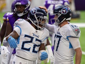 Tennessee Titans quarterback Ryan Tannehill (17) congratulates running back Derrick Henry (22) after his touchdown against the Minnesota Vikings at U.S. Bank Stadium